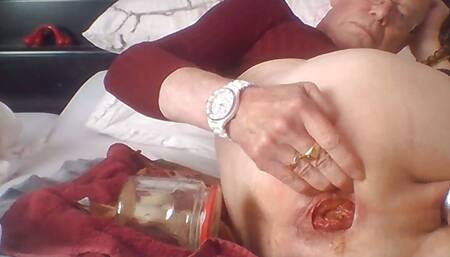 Inserting a thick jam jar into my open ass cunt 2