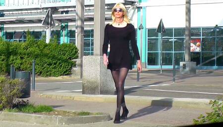 Crossdresser Femboy In Black Dress, Stockings and High Heels