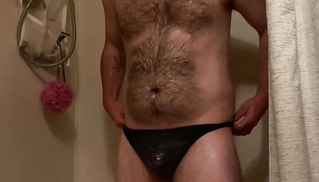 Guy showering in black thong and stroking cock