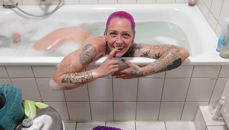 she is taking a bath and open her mouth