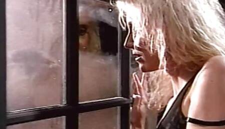 Biker chick fucks man in skull cap outside on the ground