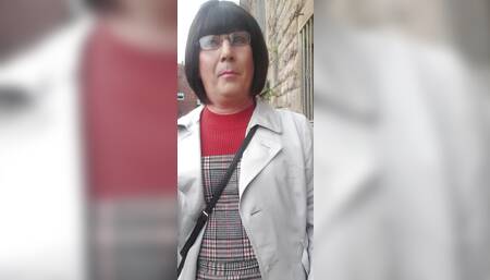 Crossdressing slut exposes her caged cock on public street