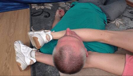 Young beauty lies on cushion keeping man`s head between legs, vf2704x 1080p