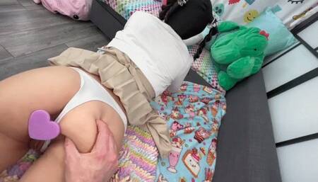 A teen school girl lays on her belly and gets fucked