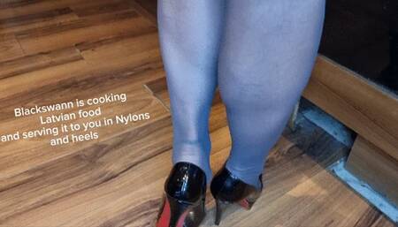 Swann is serving dinner in nylons and heels
