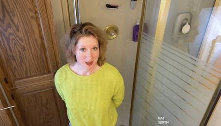 Shampooing hair and cutting clothes off in the shower