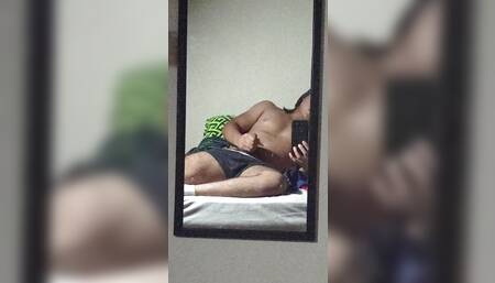 hot young man masturbates recording himself in front of the mirror