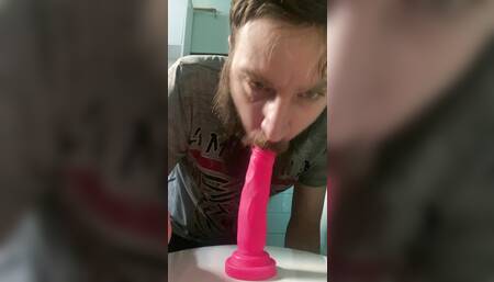 Sucking on a dildo