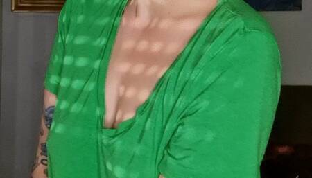 Smoking in a green shirt without bra