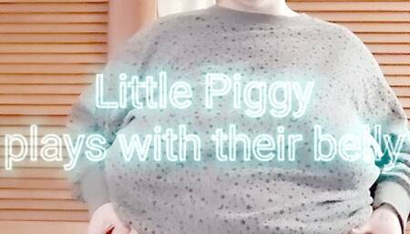 Little Piggy plays with their belly