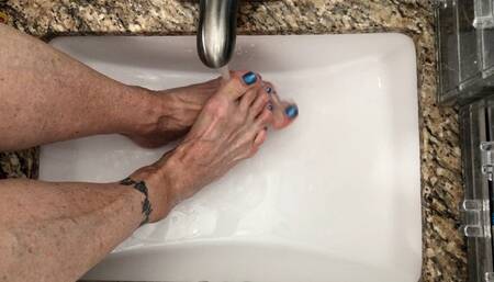Feet Under Running Water