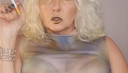 Part I - SmokerqueenJoan smokes a Chesterfield 100s divinely with metallic glossy lips*multiple puffs*snapping inhales