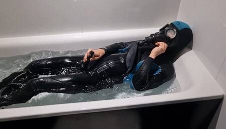 gasmask and wetsuit in bathtub cum