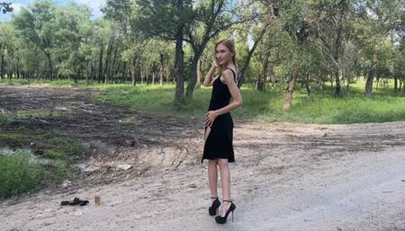 sexy hot girl in high heels walking in deep and slippery mud