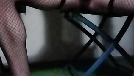 crossdresser shows off big cock and asshole in fishnet stockings outdoors