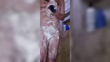 Ginger cub taking a shower