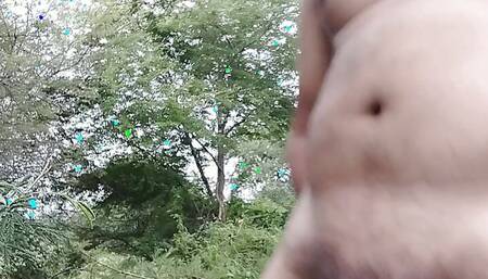 A boy roamed around in the jungle full nude, then kept shaking the cock and pressed the boobs.