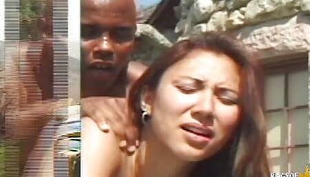 Brunette Asian girl sucks and fucks a big black cock in the garden