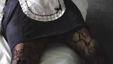 wife dressed up as sexy maid in the bedroom
