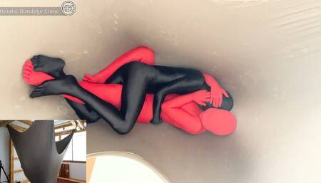 Snuggling in Zentai Suits Inside a Big Hammock