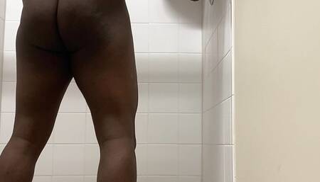 Black man in public gym showers