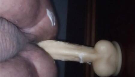 Taking big dildo creaming