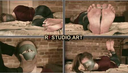 Leya in a sticky situation - Struggle and deprivation in the tight embrace of tape - Part 1 (FULL HD MP4)