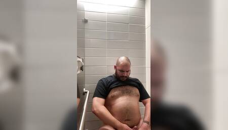 Bear Jerks Off in Public Bathroom