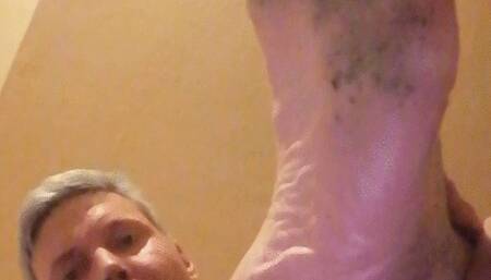 Dirty feet of mine, kneel down on the floor while looking at my dirty foot