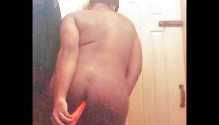 Pakistani femboy fucks himself with a carrot while standing in bathroom