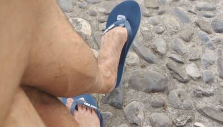 Dangling flip flops on a public bench (avi)