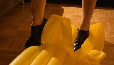 Walking and trample over pool mattress with sexy heels and crush