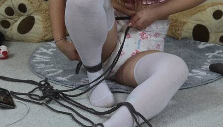 Chloe Plays While Tied Up In Diapers