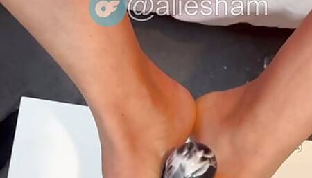 Sexy blonde gives dildo a slimy footjob!!