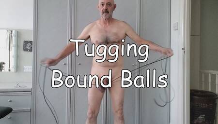 Tugging Bound Balls