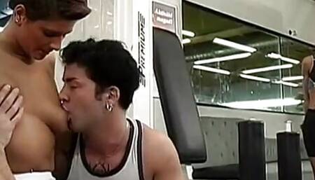 Brunette gets double penetration from ripped studs on weight bench