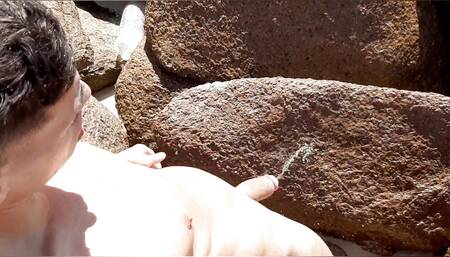 Famous football player is caught pissing on the beach