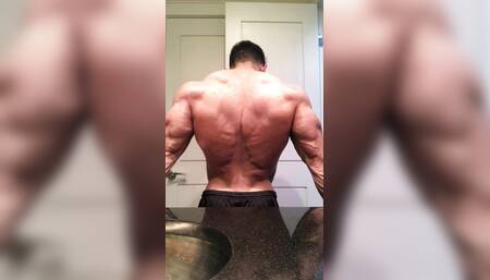 Jacked bodybuilder Benji Bastian flexing his huge, shredded, muscles