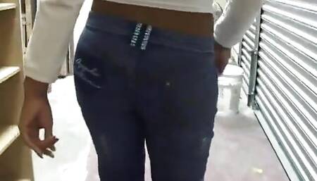 Cutie in jeans is on the toilet and rubbing her shaven pussy