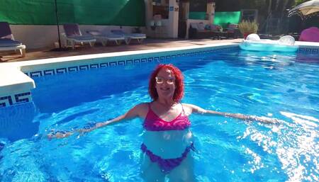 Just me, in a bikini, splashing about in a pool on holiday in Spain