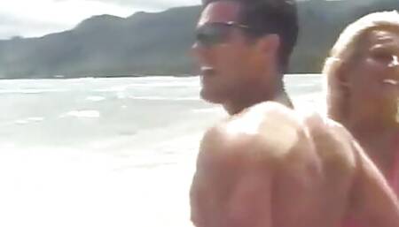 Tanned blonde and a dude are fucking on the beach