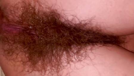 Slim super hairy MILF does anal and squirts a lot