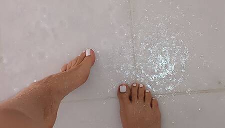 Blonde dances a little then pees in the shower