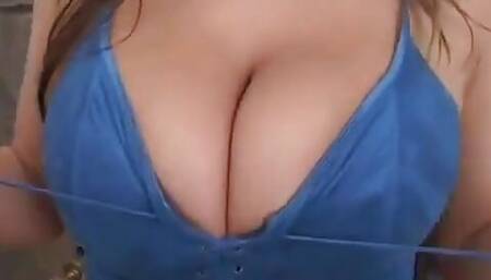 Blonde Slips a Cock Between Her Massive Tits