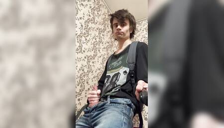 a guy with a backpack jerks off his dick in different positions and cums with a fountain of sperm