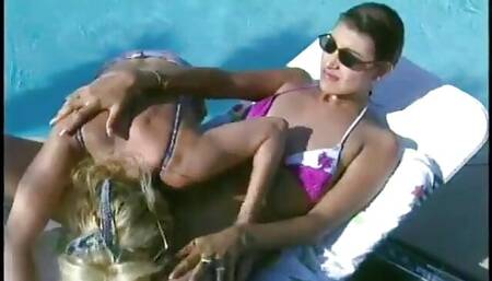 Sexy lesbian sluts pussy fucking by the pool