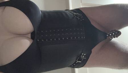 Boobs, caged cock in a corset with dildo