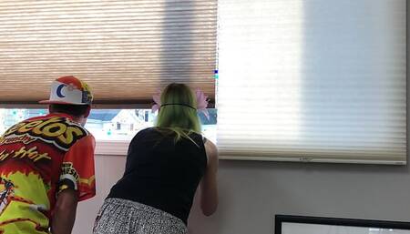 Couple Peeping Outside Apartment Window