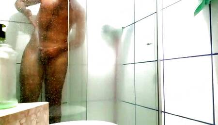 In the shower playing with his dick