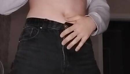 A young student in a mask plays with his dick through his panties